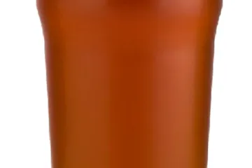 Vaso de cerveza con espuma.